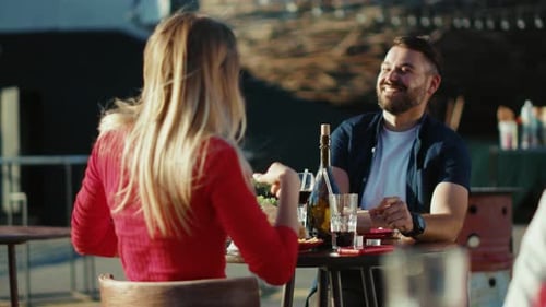 Happy Young Relaxing Man and Woman Drinking Cocktail Smiling in Street Cafe Time Together Date Food