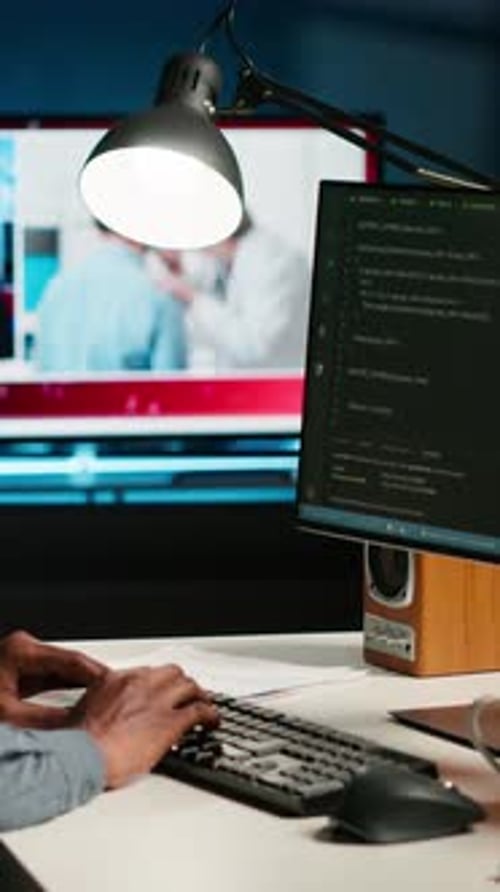 Vertical Video Developer Enters Binary Data on Terminal Panel While He Establishes Html Code