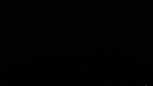 Night Aerial Establishing Shot of City Lights