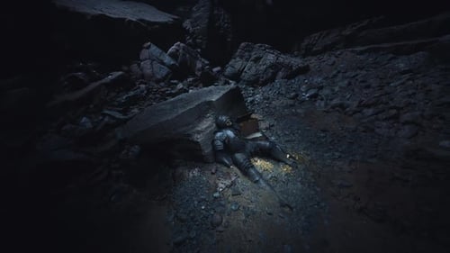 Knight Lying Lifeless in a Dark Cave Surrounded By Rocks and Shadows