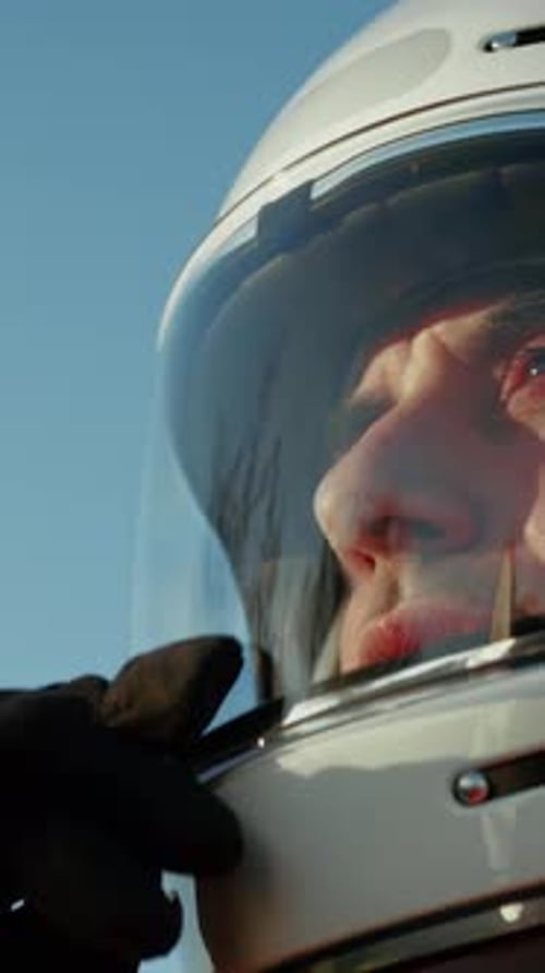 Astronaut Lowers His Helmet Visor And Prepares To Walk Into The Wasteland