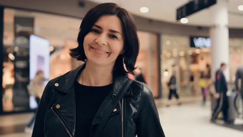 Young Attractive Woman Walking By the Shopping Mall