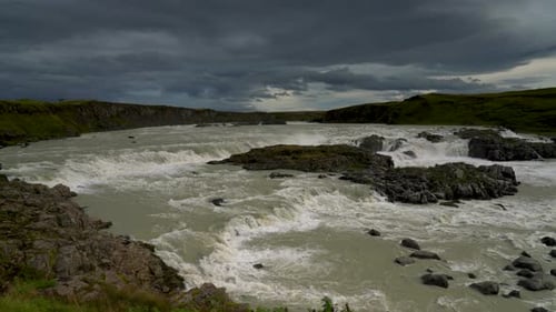 Aerial view of Urridafoss waterfall and Thjorsa river at grey cloudy day in Iceland. Wide shot.