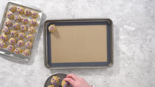 Time Lapse Flat Lay Chilled Cookie Dough Scoops on the Baking Sheet to Bake Unicorn Chocolate Chip