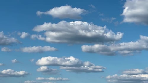 White Clouds Moving in a Blue Sky