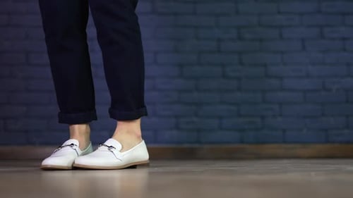 Close up view of shoes dancing. Lifestyle footwear dancing on the floor.