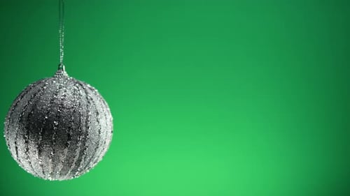 Christmas Silver Ball Decoration with Green Background