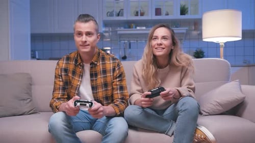 Couple Playing Video Game Together on Couch