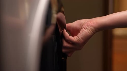 Hand Opens the Washing Machine Door, Close Up