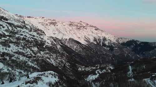 Scenic Aerial View of Snow Covered Mountain Range