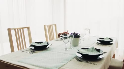 Formal dining table setting with elegant dinnerware indoors