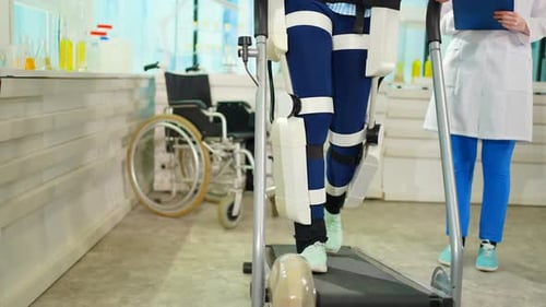 a Patient with an Injury of the Musculoskeletal System Tests an Exoskeleton Physiotherapy