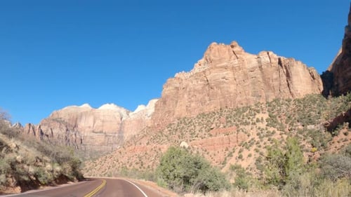 Point of view shot of a car driving through Zion National Park, Utah, United States.
