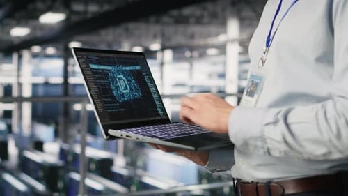 Close Up of IT Specialist in Server Room Doing AI Deep Learning Automatization