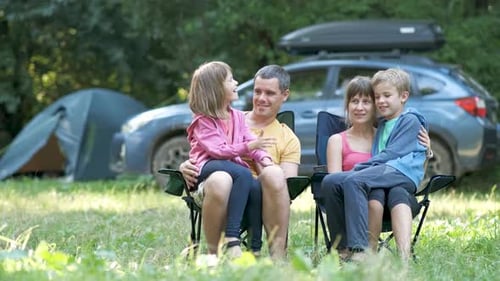 Family Togetherness at Campsite in Forest