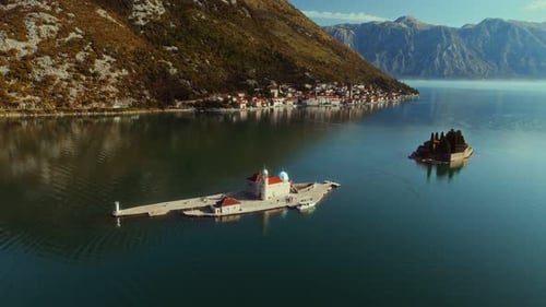 Aerial view of Church of Our Lady of the Rock near Perast city of Boka Kotor bay, Montenegro