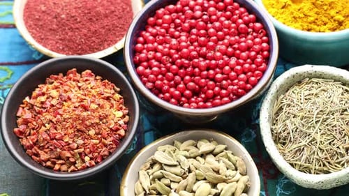 Close up of vibrant aromatic spices in bowls