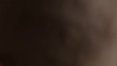 Making paper decorations on black table close up