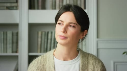 Close-up of upset girl sad tense sitting at home