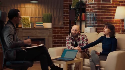 Couple Talking with Counselor in Home Office