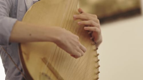 Man Plays Wooden Bandura Up Close
