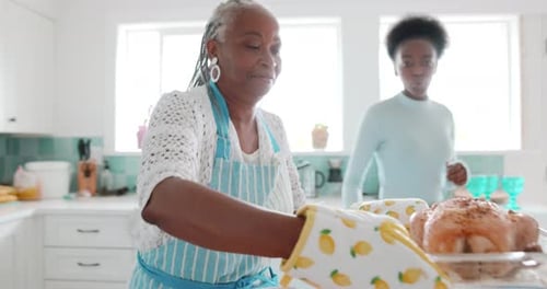 Family Prepares Roast Chicken Meal in Bright Kitchen