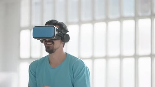 Man Playing Video Game With VR Headset