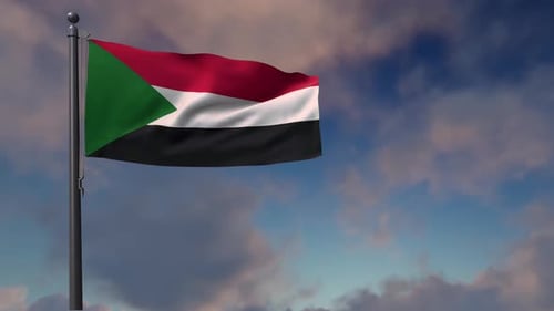 Flag of Sudan Waving Against a Cloudy Sky