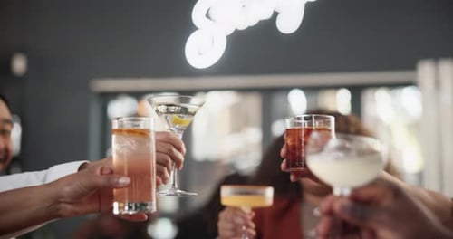 Hands, friends and cheers in restaurant, group and bonding with comedy, remember and catch up