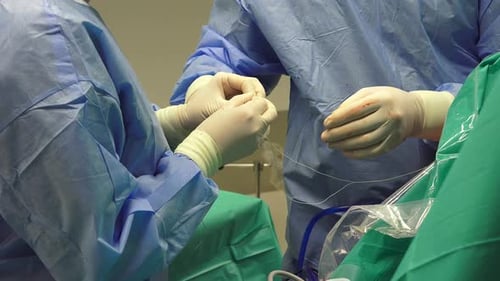 Surgeons Performing Medical Procedure in Operating Room