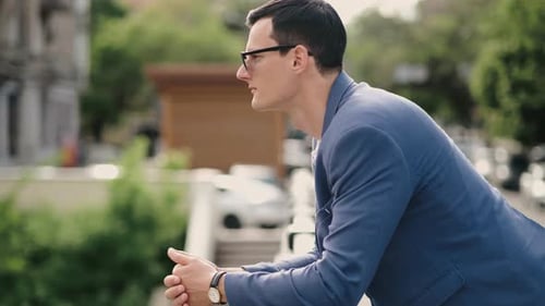 Portrait of Confident Business Man Wearing in Sunglasses and Walking at Street