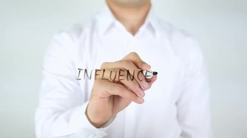 Writing Influencer Word with Black Marker