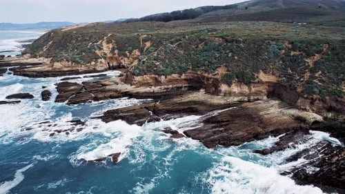 Dramatic Ocean Cliffs on the West Coast with Waves Crashing Against Rocks