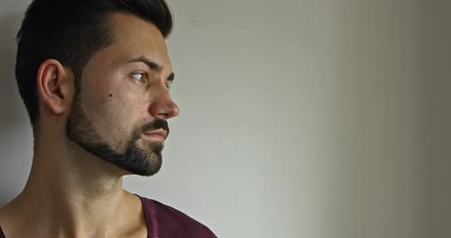 Young Adult Man Drinking Coffee Indoors