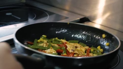 Cooking Chicken and Vegetables in Hot Pan