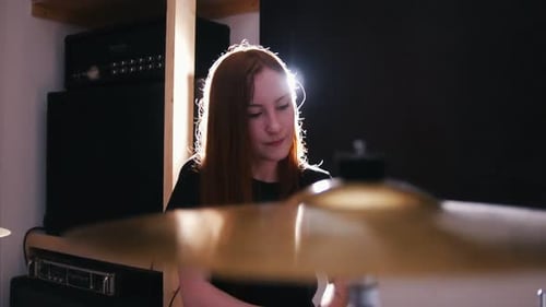 Woman Playing Drums in Recording Studio, Close Up