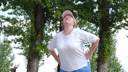 Senior Woman Doing Exercises in the Park