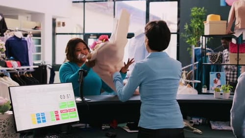 Manager Scanning Customer Clothes