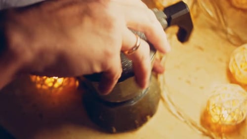 Hands Preparing Gray Speckled Moka Pot Close Up