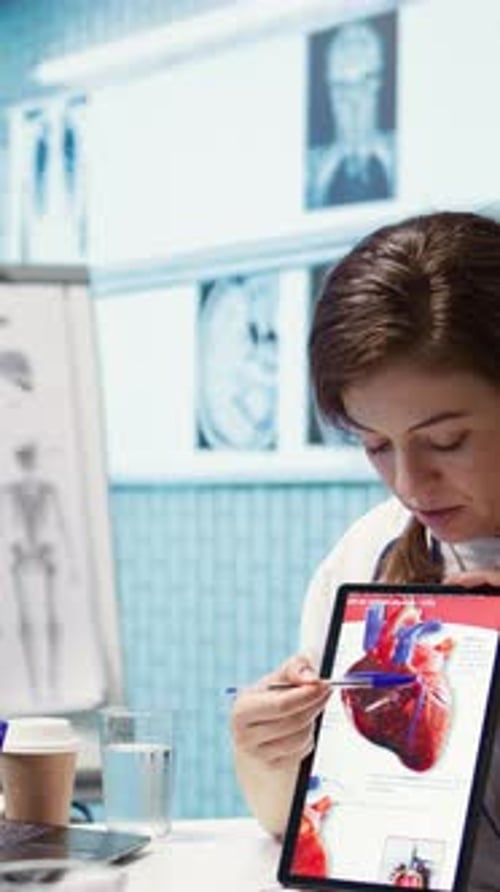 Vertical Video Woman Specialist Explaining Heart Function and Condition on Test Results