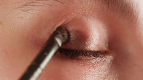 Applying Eyeshadow with Brush Close Up Shot