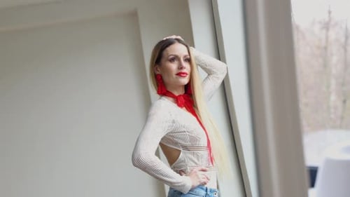 Blonde Woman Posing Indoors With Lace Top