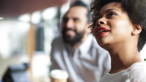 Woman talking with man at the workplace