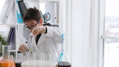 Child Scientist Conducts Science Experiment in Laboratory