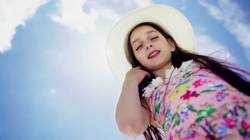 Happy Girl Smiling Under the Summer Sky