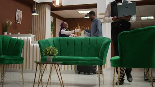 Hotel Lobby With Customer Checking In