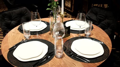 Elegantly made empty dinner tables in a chic restaurant shot with a slider