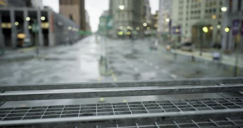 City Street After Rain Showcasing Empty Roads and Wet Surfaces During Dusk
