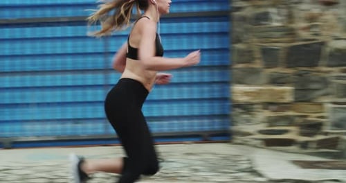 Music, listening and woman running in street with earphones in city with fast