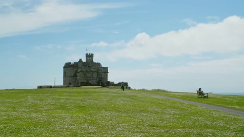 Pendenis Castle wide angle with tourists sunny day